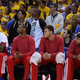 Los Angeles Clippers players sit on the bench wearing their warm-up tops inside out in Game 4 of the Western Conference Quarterfinals against the Golden State Warriors during the NBA Playoffs at Oracle Arena April 27, 2014, in Oakland, Calif. The players wore theirs warm up this way in protest of owner Donald Sterling’s racially insensitive remarks.
Thearon W. Henderson/Getty Images